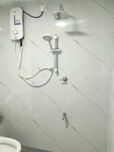 a shower in a bathroom with a toilet at Eco Bliss in Ahangama