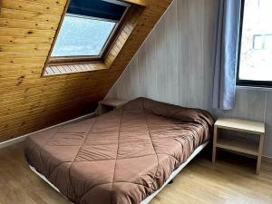 a small bedroom with a bed and a window at Apartamentos Solaris 3000 in Pas de la Casa +65 photos