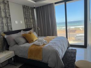 En eller flere senge i et værelse på Seacrest