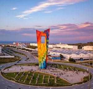 a large colorful monument in a city with a street at Mirador Apartments – Excellent Location by SOHO in Barranquilla