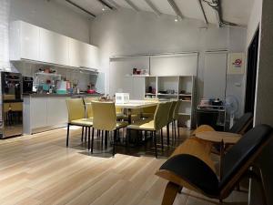 a kitchen and dining room with a table and chairs at 哈娜家Villa 