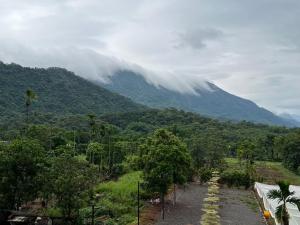 a mountain in the distance with a cloud over it at 哈娜家Villa 