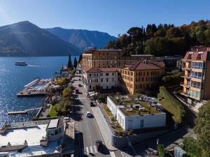 an aerial view of a town next to a body of water at Residenza di Luce - by MyHomeInComo in Griante Cadenabbia