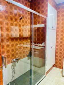a shower in a bathroom with a glass shower stall at Casa Joan de l'Illa in Deltebre