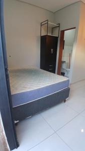 En eller flere senge i et værelse på 103 Flats Magguine - Interlagos