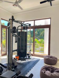 a room with a gym with a large window at Trident Kandy in Kandy