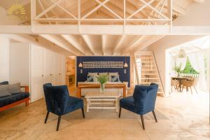 a living room with a table and two chairs at Mahona Boutique Hotel in Las Terrenas