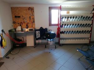 a room with a room with a bunch of knives at Appartamenti Pila Vacanze 2 in Cerise