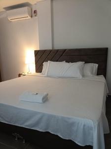 Ένα ή περισσότερα κρεβάτια σε δωμάτιο στο Hotel Guadalupe Acacías