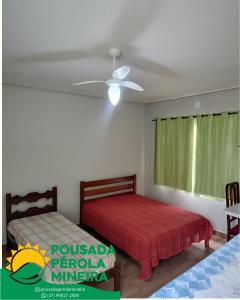 Postel nebo postele na pokoji v ubytování Pousada Pérola Mineira