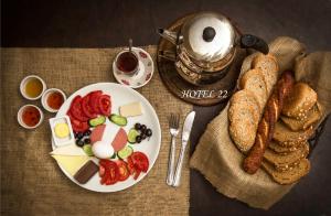 a plate of food with eggs and bread and toast at Home 22 Otel in Edirne