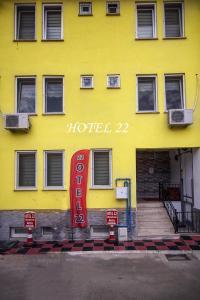 a yellow building with a hotel sign on it at Home 22 Otel in Edirne