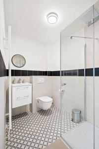 a bathroom with a toilet and a glass shower at Ubytování Dva v centru in Velké Meziříčí