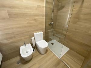 a bathroom with a toilet and a shower at Sister's House by east ALgarve guest in Tavira