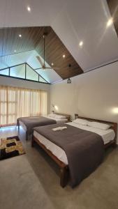 Ένα ή περισσότερα κρεβάτια σε δωμάτιο στο Lakshmi Homestay