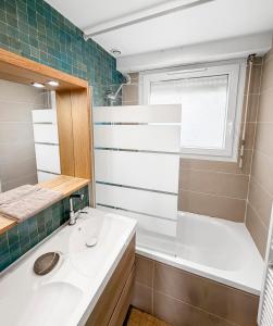 a bathroom with a sink and a shower at Marluis Mer - Apartment near dunes and beach in Cucq +35 photos