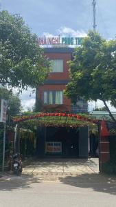 a building with flowers on the front of it at Nhà Nghỉ PHÚC THỊNH 