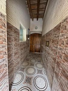 an empty room with a tiled floor in a building at Dar Ben Othman in Tozeur