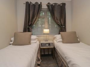 Ένα ή περισσότερα κρεβάτια σε δωμάτιο στο Evermore Lodge