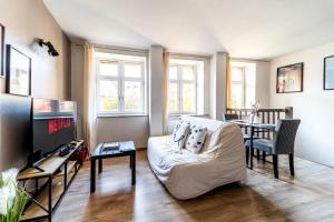 TV a/nebo společenská místnost v ubytování Le Refuge - Parking privée - Wifi - Netflix