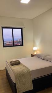 Ένα ή περισσότερα κρεβάτια σε δωμάτιο στο Apartamento Modernizado