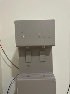 a machine is plugged into a wall at Hotel Benoni in Papar