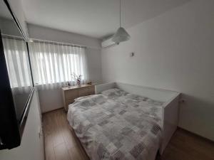 Ένα ή περισσότερα κρεβάτια σε δωμάτιο στο S&SApartment