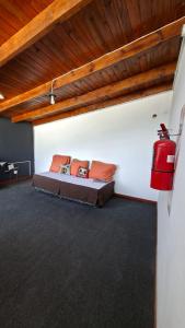 a bedroom with a bed in a room with a ceiling at Posada Ruta 65 in General Fernández Oro