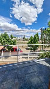 a view from the roof of a house with a fence at Posada Ruta 65 in General Fernández Oro