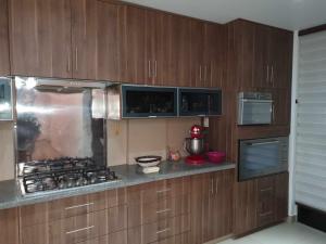 Η κουζίνα ή μικρή κουζίνα στο Departamento Calido