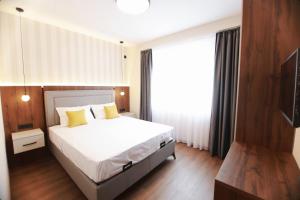 Ένα ή περισσότερα κρεβάτια σε δωμάτιο στο Sirion Apartments