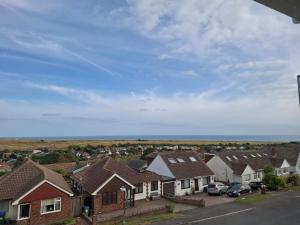 a row of houses in a residential neighbourhood at 4 Bedroom House in Saltdean, Brighton in Brighton & Hove