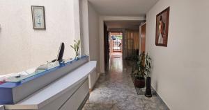 a hallway with a glass counter in a building at Casa del Pino in Popayan