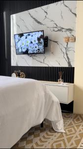 Ένα ή περισσότερα κρεβάτια σε δωμάτιο στο May grid +8 φωτογραφίες