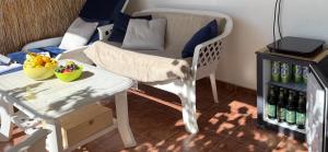 a living room with a chair and a table at Summer house Kruce in Kruče