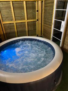 a large jacuzzi tub in a room at maison chaleureuse ,avec piscine, spa, Futuroscope in Jaunay-Marigny