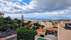 a view of a city from a balcony of a building at Skyview Apartment in Adeje