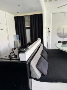 a living room with a bed and a table at Serenity Room at Villa Love in Seminyak