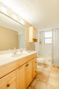 a bathroom with a sink and a toilet at Welcome to Your Serene Waterfront Getaway! in Cocoa +97 photos