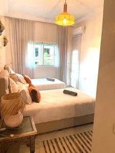 Giường trong phòng chung tại Flair's - Families Only +12 ảnh