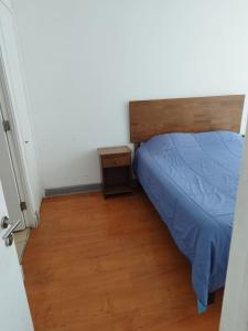 Ένα ή περισσότερα κρεβάτια σε δωμάτιο στο departamento en el centro de iquique familiar +3 φωτογραφίες