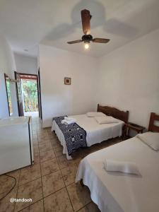 Ένα ή περισσότερα κρεβάτια σε δωμάτιο στο Pousada São José da Serra +8 φωτογραφίες