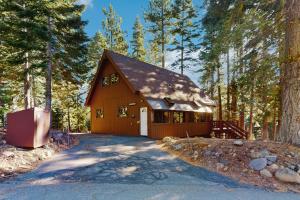 a house in the woods with a driveway at Talmont Trailhead Cabin in Tahoe City