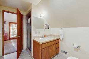 a bathroom with a sink and a mirror at Talmont Trailhead Cabin in Tahoe City +23 photos