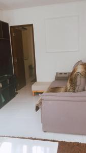 a living room with a couch and a table at Apartamento com ótima localização! in Belém +7 photos