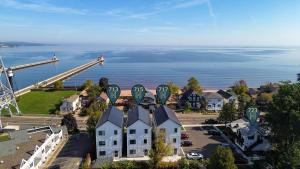 an aerial view of a town with a roller coaster at Dragestil 713 Duluth Luxury Condos by Heirloom Boutique Collection in Duluth