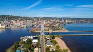 an aerial view of a bridge over a body of water at Dragestil 713 Duluth Luxury Condos by Heirloom Boutique Collection in Duluth