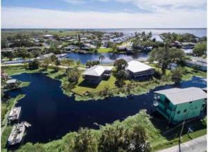 an aerial view of a marina with boats in the water at Peace on the River, Breathtaking Views in Cocoa