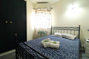 a bedroom with a bed with two towels on it at Alcaria Pool House in Altura +15 photos