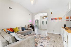 a living room with a couch and a table at Cozy 3BR 2BA Getaway Legoland Winterhaven in Lakeland